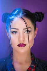 Closeup portrait of beautiful young woman with green eyes and dark lipstick