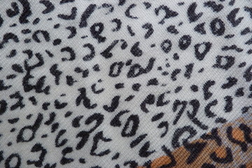 motley colored fabric scarf dress close-up background for design background textile cloth clothes vintage natural fabric flax cotton wool abstract illustration white-black leopard print drawing