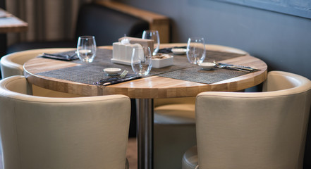 Table setting, interior elements and  silverware in japanese restaurant for sushi