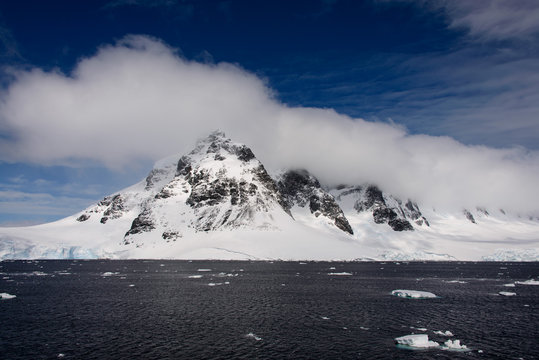 Antarctic landscape with sea and mountains