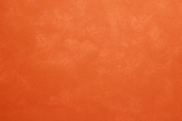 A ginger rural old wall with a scratch distressed patina.