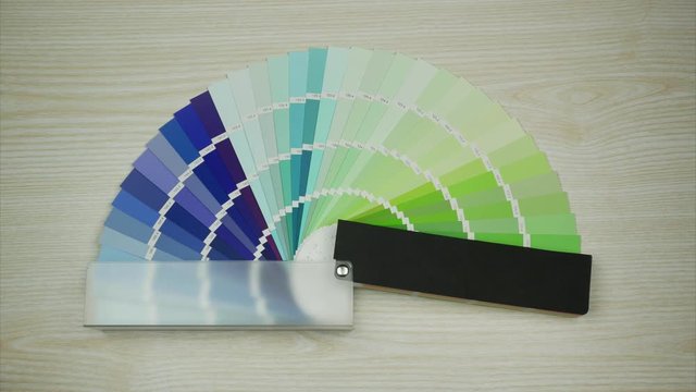 Color Swatches Book with Rainbow Sample. Stop motion.