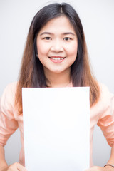 Business women holding blank white paper for put message