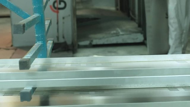 worker in factory grinding metal