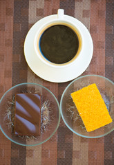 A cup of coffee and Chocolate and golden threads cake