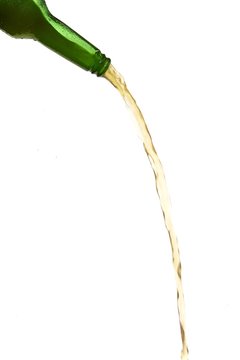 Beer Pouring From Green Bottle On White Background