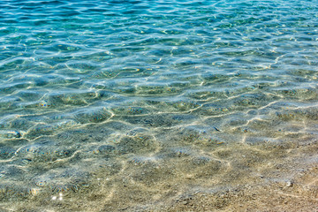 Fototapeta na wymiar Clear waters by the beach