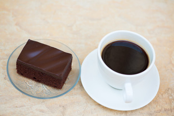 A cup of coffee and Chocolate cake