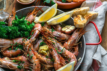 Close view of tiger prawn shrimps roasted with lemon garlic and wine
