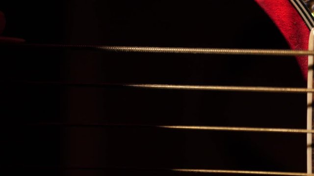 Guitar string macro close up super slow motion