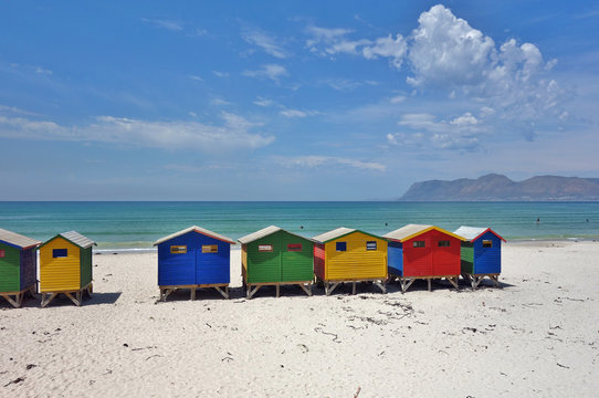 View of the brightly colored Victorian beach cabin houses on the Muizenberg Beach in Cape Town