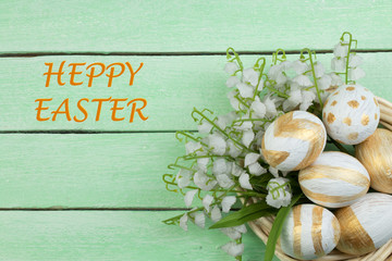 Fototapeta na wymiar Happy Easter. Painted eggs on wooden table. Top view. Copy space for text.