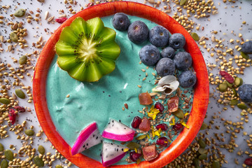Acai bowl smoothie with kiwi blueberry seeds