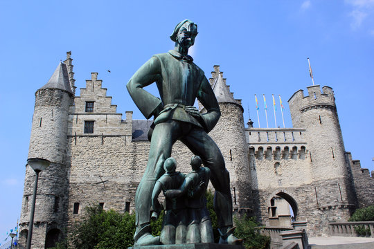 Belgium, Flanders, Antwerp, Statue of Lange Wapper outside Maritime Museum, Steen Castle