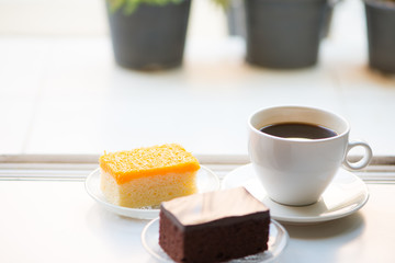 A cup of coffee and Chocolate and golden threads cake