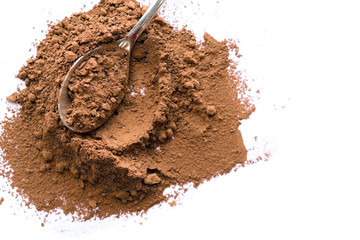 pile cocoa powder in a scoop isolated on white. heap of fresh of chocolate studio shot