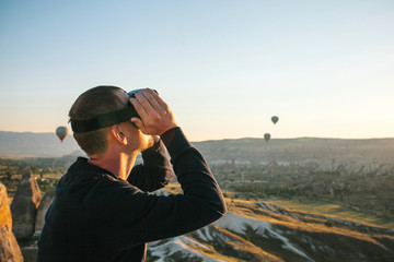 Fototapeta premium The man with glasses of virtual reality. Future technology concept. Modern imaging technology.