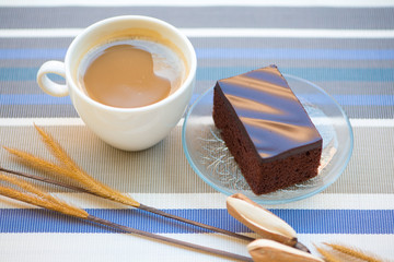 A cup of coffee and Chocolate cake
