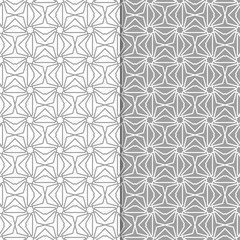 Gray and white geometric ornaments. Set of seamless patterns