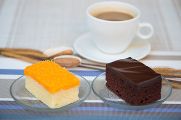 Chocolate and golden threads cake and a cup of coffee background