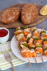 Skewers with chicken, peppers and onions.