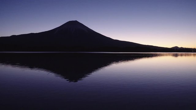Mt. Fuji Reflected in a Calm Lake at Dawn