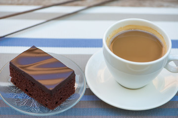 A cup of coffee and Chocolate cake