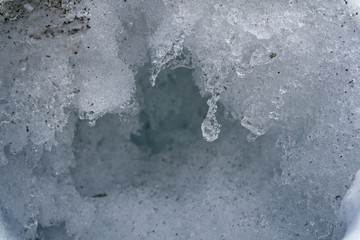Snow Winter background, close-up of frosted ice lump on a snowing day with copy space