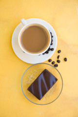 A cup of coffee and Chocolate cake