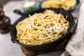 Spaghetti carbonara with egg and pancetta