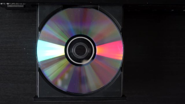 Compact disc, top shot eject (or insert) from CD-player.