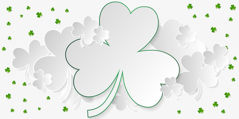 Horizontal banner with white and green clover with copy space in paper art style on light gray background. Vector illustration.