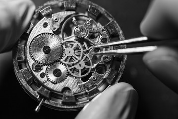 Watchmaker is repairing the mechanical watches in his workshop