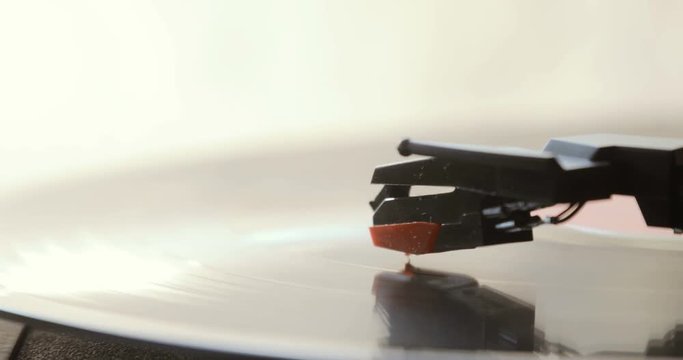 Close up of vinyl record on DJ turntable record player