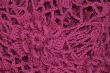  beautiful pattern of flowers crocheted from shirstyannyh thread dark cherry color. Sweater background