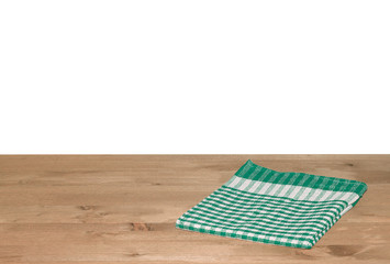 Empty wooden deck table with tablecloth for product montage. Free space for your text