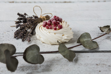 Pavlova cakes with cream and fresh summer berries - 192381887