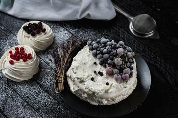 Pavlova cakes with cream and fresh summer berries - 192382002