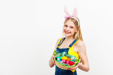 Teenage girl holding Easter eggs