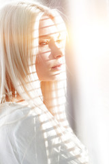 Fototapeta premium Close-up of a pensive young business woman looking out the window