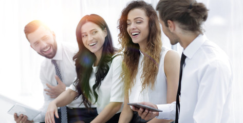 business team with tablet sitting in the office.