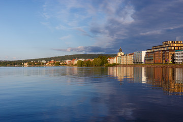 Reflections of a city on a lake