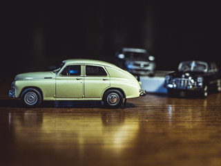 Fototapeta na wymiar little car models on the table close up shot