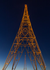 Illuminated radio tower by night