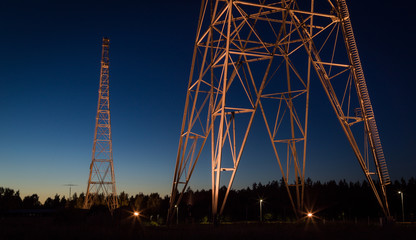 Illuminated radio tower by night