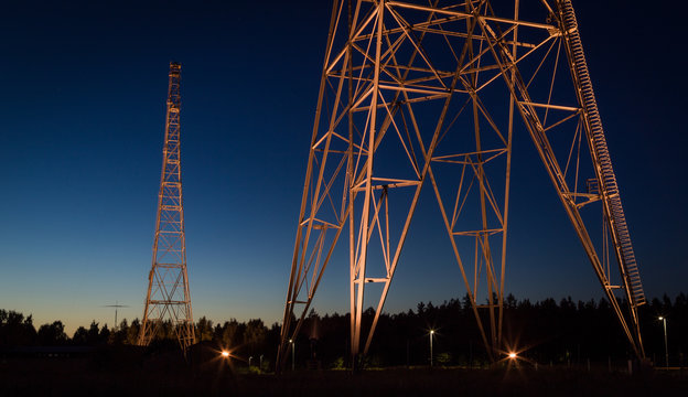 Illuminated radio tower by night