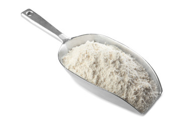 Scoop with wheat flour on white background