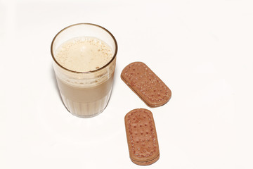 Tea with milk or popularly known as Teh Tarik and  biscuits isolated in white