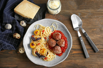 Delicious pasta with meat balls and tomato sauce on plate