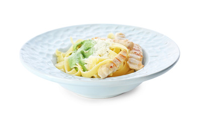 Delicious pasta with chicken on plate against white background